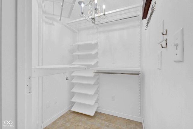 7383 Poppyseed Dr, Indianapolis, IN 46237 - walk in closet with a chandelier