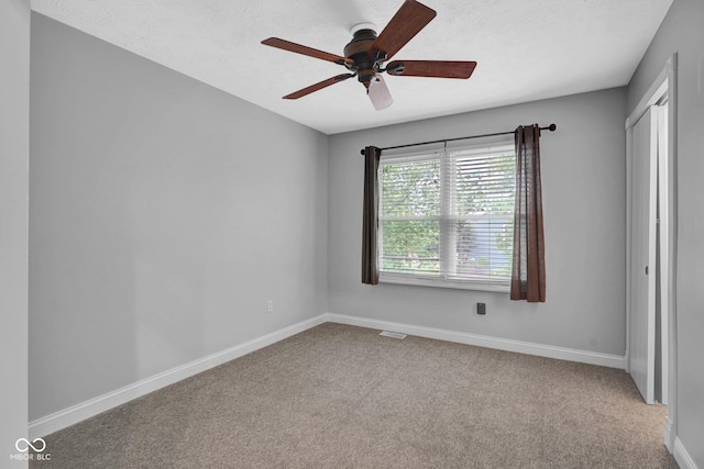 7383 Poppyseed Dr, Indianapolis, IN 46237 - unfurnished room featuring ceiling fan, baseboards, carpet, and a textured ceiling
