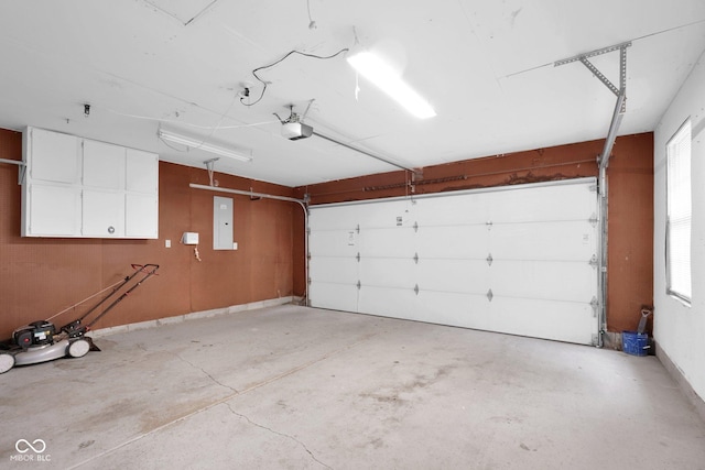 7383 Poppyseed Dr, Indianapolis, IN 46237 - garage featuring electric panel and a garage door opener