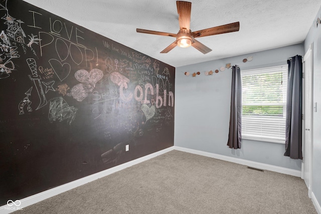 7383 Poppyseed Dr, Indianapolis, IN 46237 - carpeted spare room with ceiling fan, baseboards, and a textured ceiling