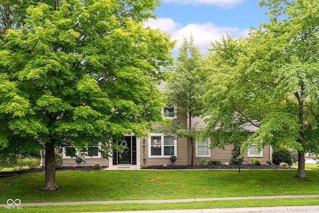 7383 Poppyseed Dr, Indianapolis, IN 46237 - obstructed view of property featuring a front lawn