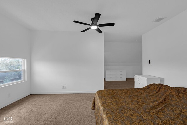 bedroom featuring carpet floors, ceiling fan, visible vents, and baseboards