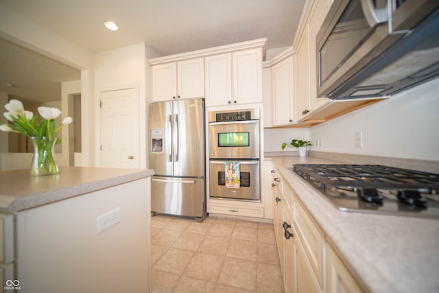 kitchen with recessed lighting, light countertops, and appliances with stainless steel finishes