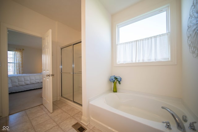 full bathroom with visible vents, a stall shower, a bath, and connected bathroom