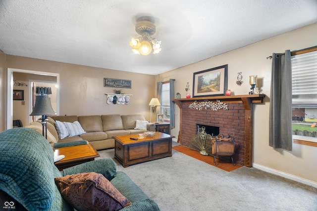 living room featuring a textured ceiling, baseboards, carpet, and a fireplace