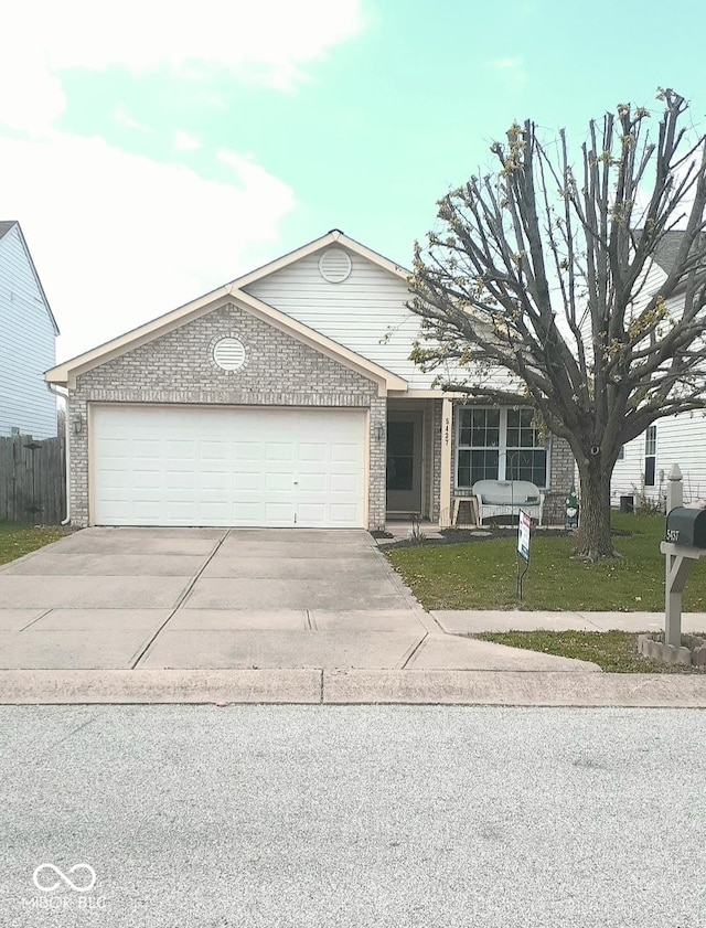 single story home with concrete driveway, brick siding, and an attached garage