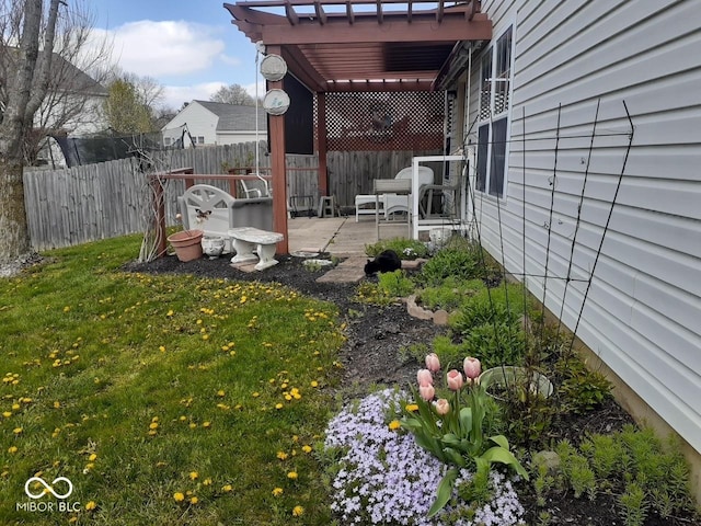 view of yard with a patio area, fence, and a pergola
