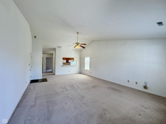 unfurnished living room with visible vents, carpet, and ceiling fan