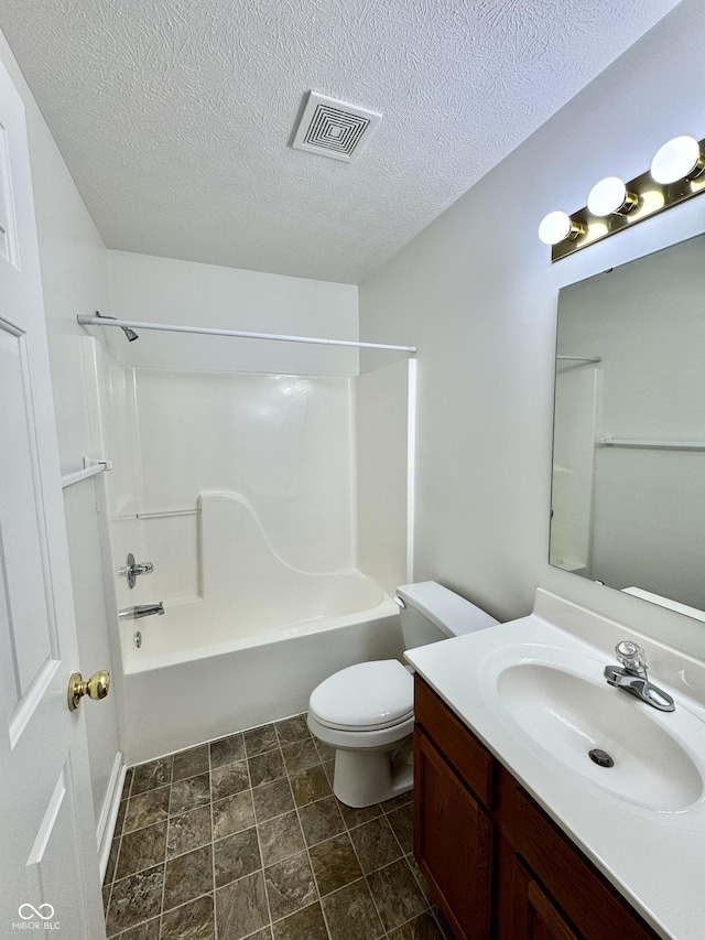 bathroom with visible vents, a textured ceiling, toilet, and vanity