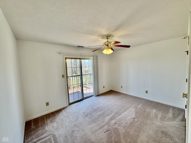 carpeted empty room with baseboards, a textured ceiling, and ceiling fan