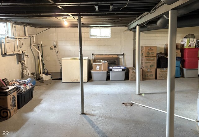 5368 Southeastern Ave, Indianapolis, IN 46203 - basement with fridge