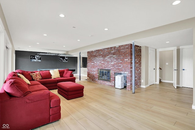 22 Point Ln, Arcadia, IN 46030 - living area with a fireplace, light wood finished floors, and recessed lighting