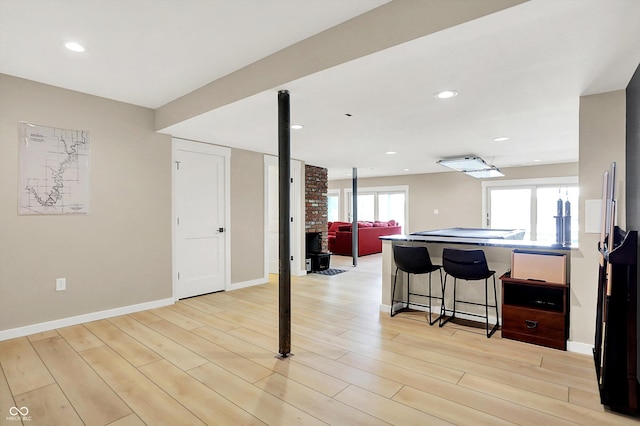 22 Point Ln, Arcadia, IN 46030 - kitchen with a breakfast bar, light wood-type flooring, a peninsula, open floor plan, and recessed lighting