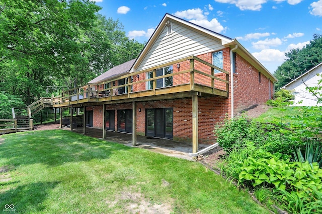 22 Point Ln, Arcadia, IN 46030 - rear view of house with brick siding, a yard, a wooden deck, and stairway