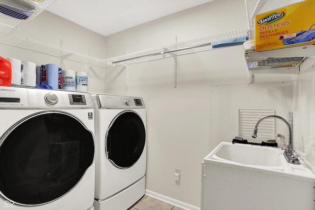22 Point Ln, Arcadia, IN 46030 - laundry room featuring washer and dryer and light tile patterned floors