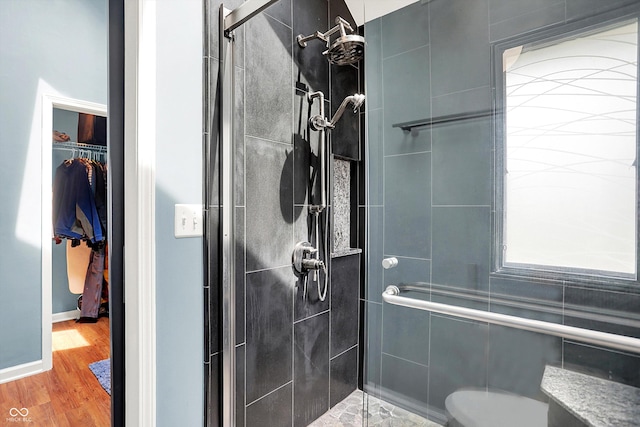22 Point Ln, Arcadia, IN 46030 - bathroom featuring a shower stall, wood finished floors, and a walk in closet