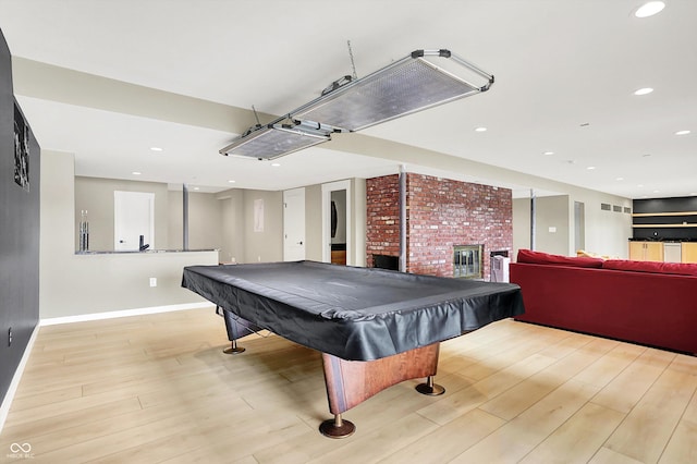 22 Point Ln, Arcadia, IN 46030 - rec room featuring light wood finished floors, billiards table, recessed lighting, and a glass covered fireplace