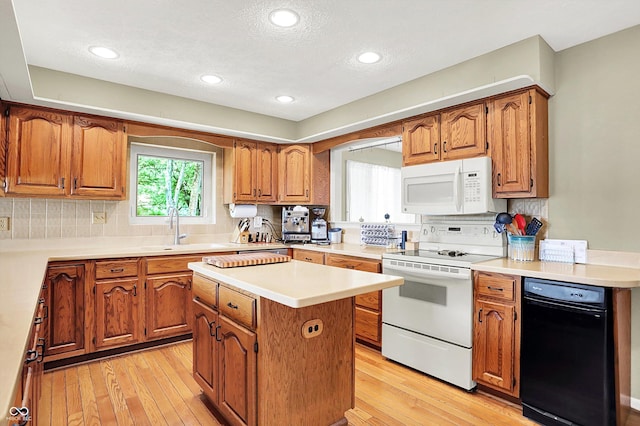 22 Point Ln, Arcadia, IN 46030 - kitchen with white appliances, brown cabinets, a textured ceiling, and recessed lighting