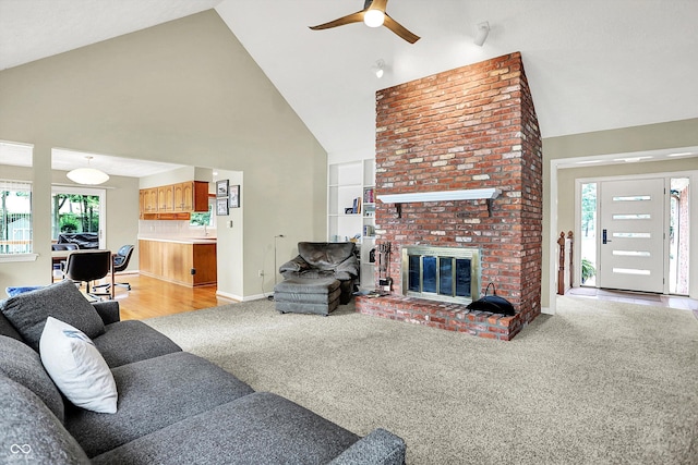 22 Point Ln, Arcadia, IN 46030 - living room with high vaulted ceiling, a ceiling fan, healthy amount of natural light, light colored carpet, and a fireplace