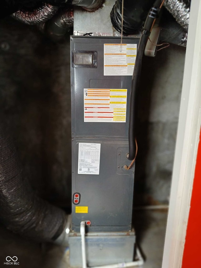 utility room with heating unit