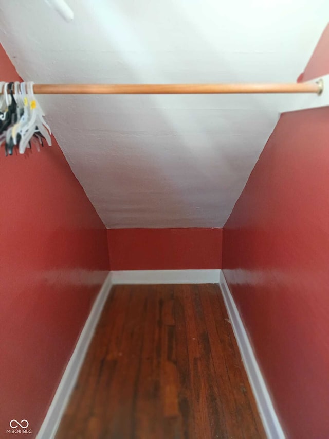 interior space with baseboards and wood finished floors