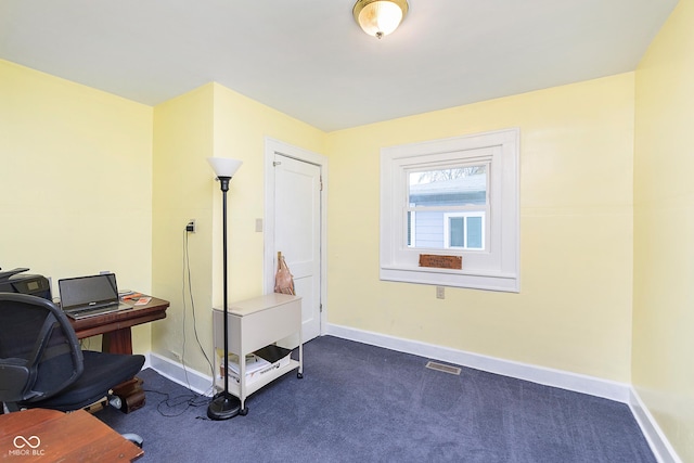 office featuring baseboards, carpet flooring, and visible vents