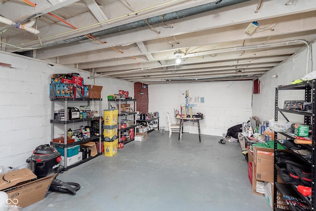 unfinished basement with concrete block wall