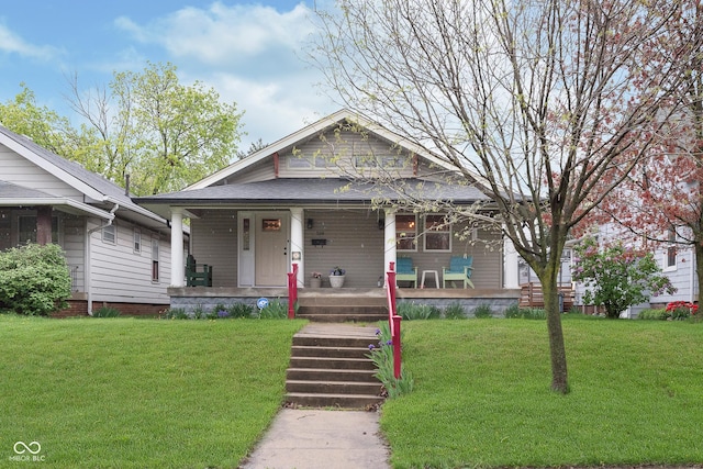 view of front of house with a porch and a front lawn