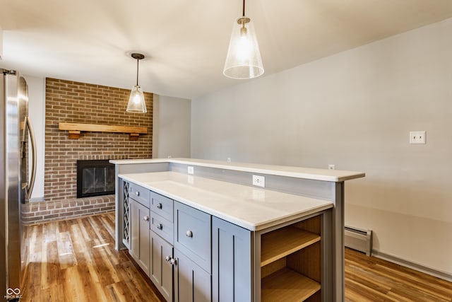 7859 N Chester Ave, Indianapolis, IN 46240 - kitchen featuring freestanding refrigerator, open shelves, light countertops, gray cabinets, and a baseboard radiator