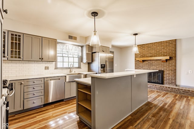 7859 N Chester Ave, Indianapolis, IN 46240 - kitchen with stainless steel appliances, a sink, a kitchen island, and gray cabinets