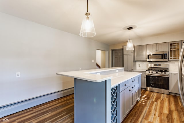 7859 N Chester Ave, Indianapolis, IN 46240 - kitchen with stainless steel appliances, gray cabinets, tasteful backsplash, dark wood-type flooring, and light countertops