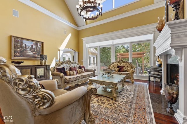 10821 Club Point Dr, Fishers, IN 46037 - living room featuring an inviting chandelier, dark wood-style flooring, high vaulted ceiling, and a premium fireplace