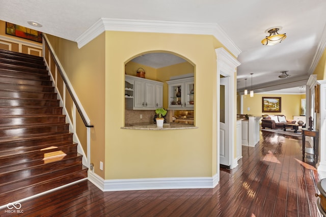 10821 Club Point Dr, Fishers, IN 46037 - foyer entrance with dark wood finished floors, stairs, crown molding, and baseboards