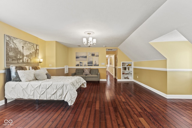 10821 Club Point Dr, Fishers, IN 46037 - bedroom featuring baseboards, vaulted ceiling, wood finished floors, and a chandelier