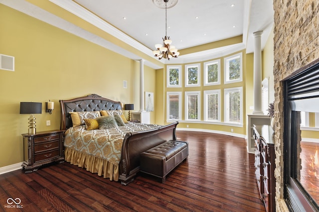 10821 Club Point Dr, Fishers, IN 46037 - bedroom featuring hardwood / wood-style floors, baseboards, a notable chandelier, and ornate columns
