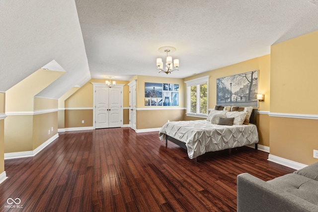10821 Club Point Dr, Fishers, IN 46037 - bedroom featuring lofted ceiling, baseboards, a chandelier, a textured ceiling, and hardwood / wood-style flooring