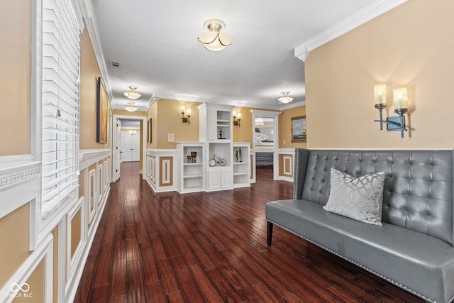 10821 Club Point Dr, Fishers, IN 46037 - living area with a wainscoted wall, dark wood-type flooring, and crown molding