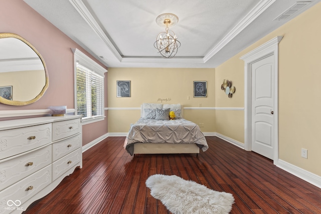 10821 Club Point Dr, Fishers, IN 46037 - bedroom featuring dark wood-style floors, visible vents, baseboards, and a raised ceiling