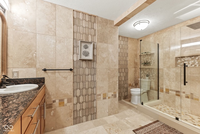 10821 Club Point Dr, Fishers, IN 46037 - bathroom with toilet, vanity, a shower stall, a textured ceiling, and tile walls