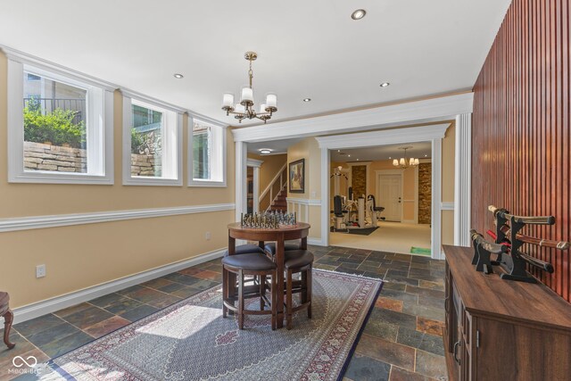 10821 Club Point Dr, Fishers, IN 46037 - dining space with an inviting chandelier, stone tile flooring, baseboards, and recessed lighting