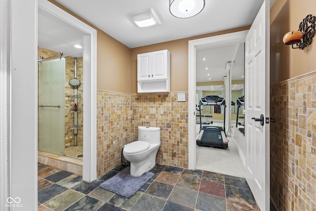 10821 Club Point Dr, Fishers, IN 46037 - bathroom with tile walls, toilet, and a stall shower