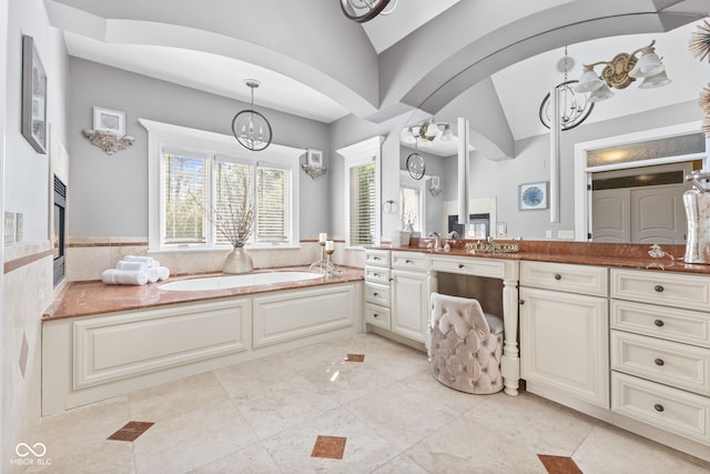 10821 Club Point Dr, Fishers, IN 46037 - full bath featuring an inviting chandelier, vanity, vaulted ceiling, and a bath