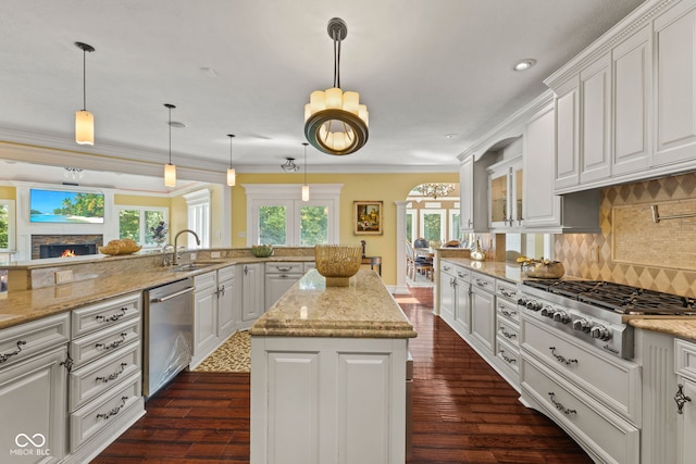 10821 Club Point Dr, Fishers, IN 46037 - kitchen with white cabinets, a sink, appliances with stainless steel finishes, and crown molding