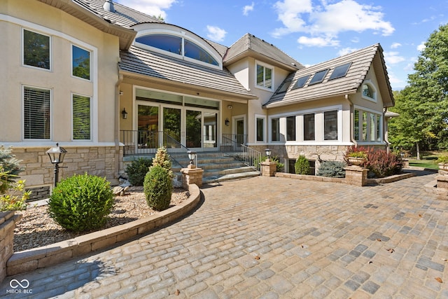 10821 Club Point Dr, Fishers, IN 46037 - back of property featuring stucco siding, stone siding, and french doors