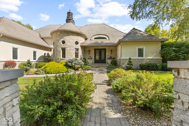 10821 Club Point Dr, Fishers, IN 46037 - french provincial home with stucco siding, stone siding, and french doors