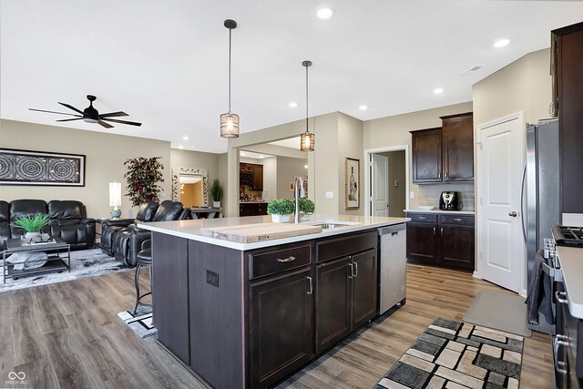 1684 Beach St, Greenwood, IN 46143 - kitchen featuring a sink, open floor plan, light countertops, and dishwasher