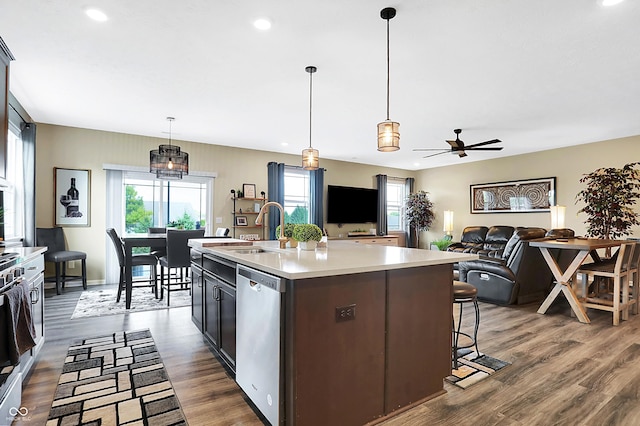 1684 Beach St, Greenwood, IN 46143 - kitchen featuring light countertops, a sink, a ceiling fan, stainless steel dishwasher, and dark wood-style flooring