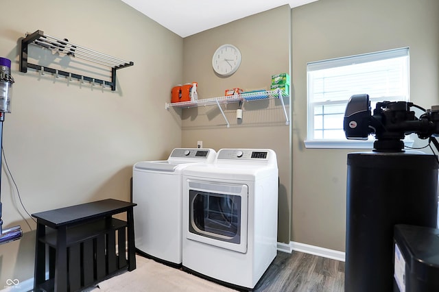 1684 Beach St, Greenwood, IN 46143 - laundry area featuring washing machine and clothes dryer, baseboards, laundry area, and wood finished floors