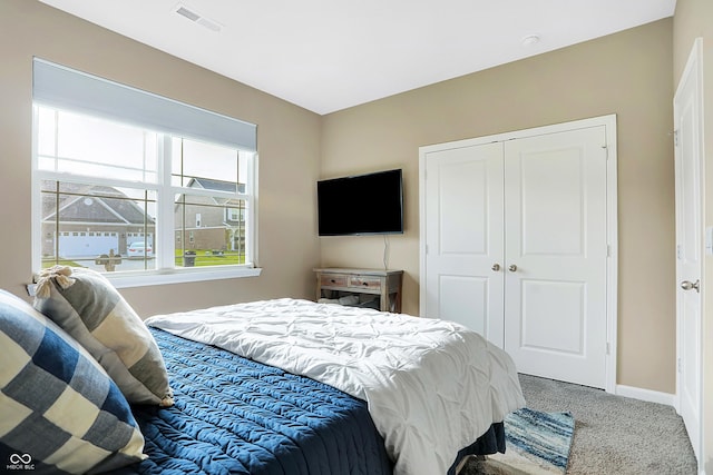1684 Beach St, Greenwood, IN 46143 - carpeted bedroom with a closet, baseboards, and visible vents