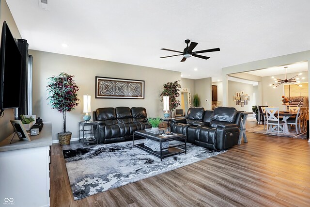 1684 Beach St, Greenwood, IN 46143 - living area with recessed lighting, ceiling fan with notable chandelier, baseboards, visible vents, and wood finished floors
